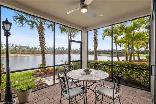 a view of a city from a dining room with floor to ceiling windows