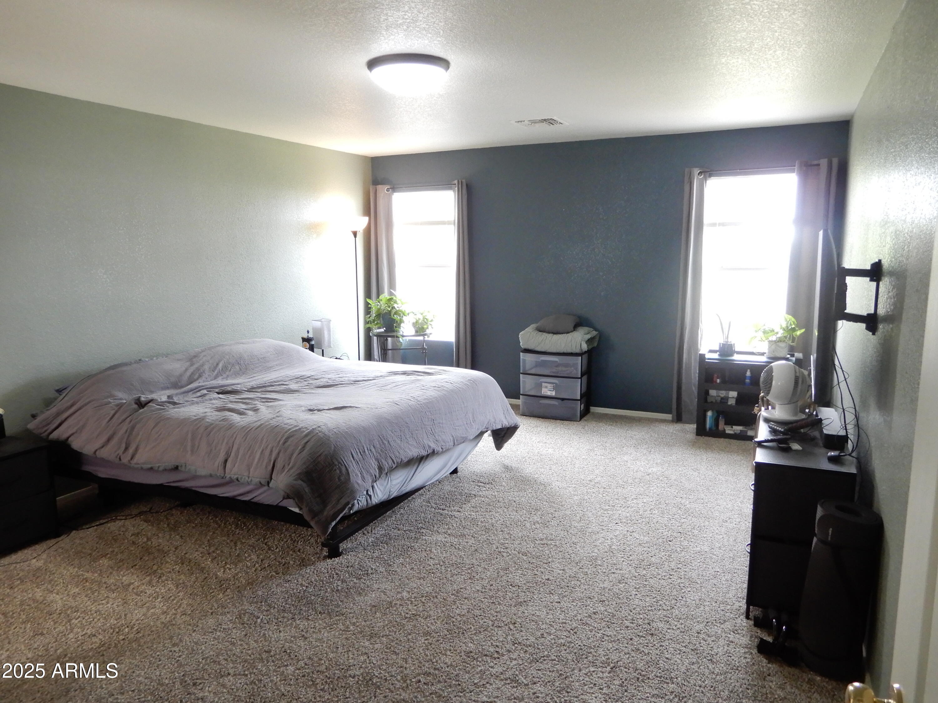 3436 South Chaparral Road Apache Junction, AZ 85119 - Photo 13 of 28 a bedroom with a bed and furniture