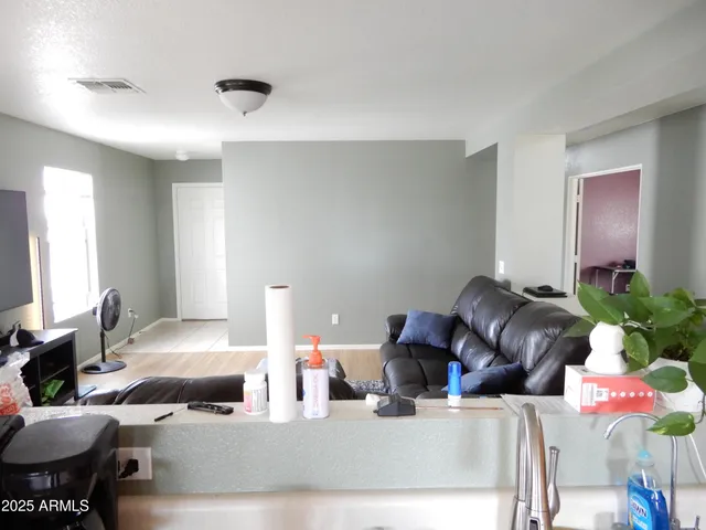 a kitchen with a sink stove top oven and cabinets