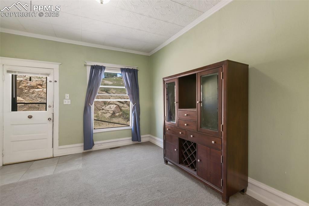 210 7th Street Victor, CO 80860 - Photo 11 of 38 an empty room with windows and closet