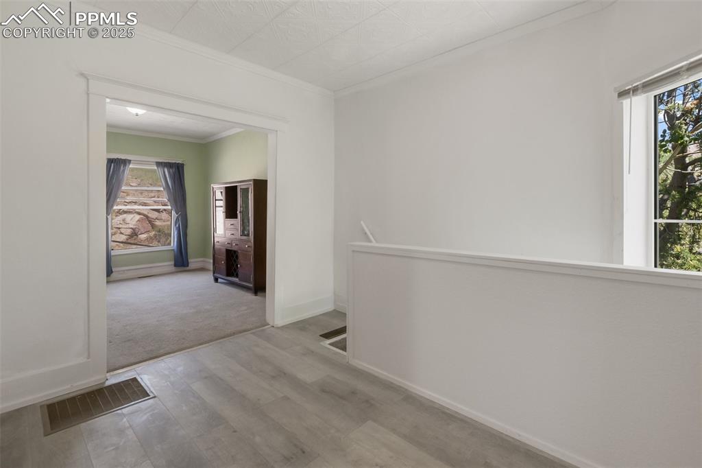 210 7th Street Victor, CO 80860 - Photo 13 of 38 an empty room with windows and closet