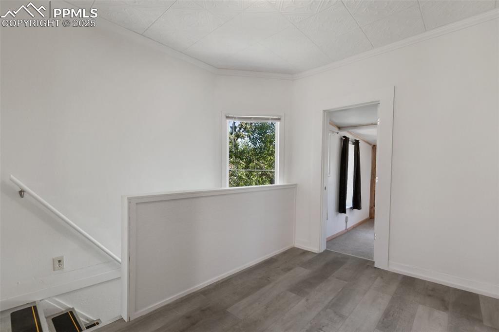 210 7th Street Victor, CO 80860 - Photo 15 of 38 a view of a room with wooden floor and windows