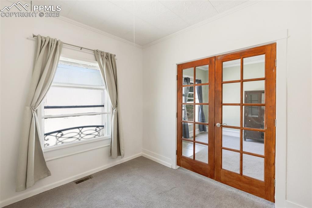 210 7th Street Victor, CO 80860 - Photo 17 of 38 an empty room with windows