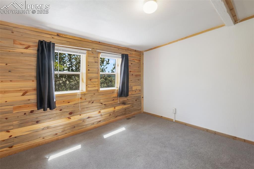 210 7th Street Victor, CO 80860 - Photo 22 of 38 a view of an empty room with a window