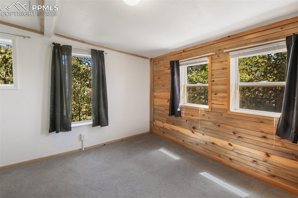 210 7th Street Victor, CO 80860 - Photo 23 of 38 a view of an entryway with wooden floor and windows