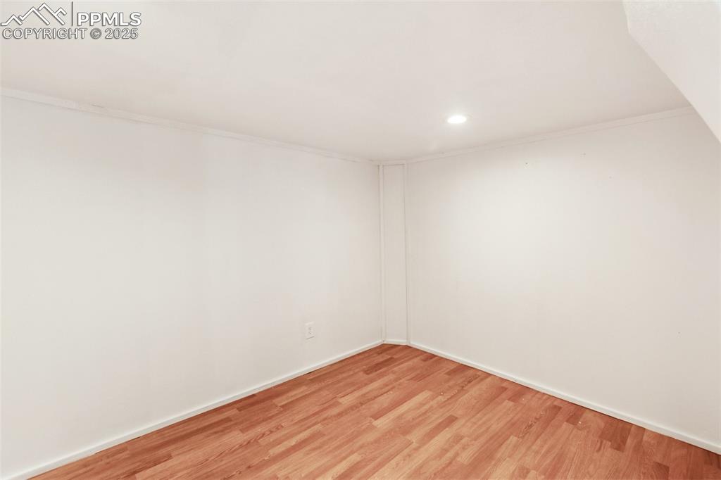 210 7th Street Victor, CO 80860 - Photo 32 of 38 a view of empty room with wooden floor