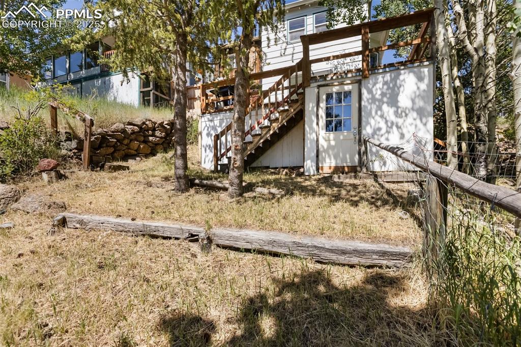 210 7th Street Victor, CO 80860 - Photo 4 of 38 a view of a yard with large tree