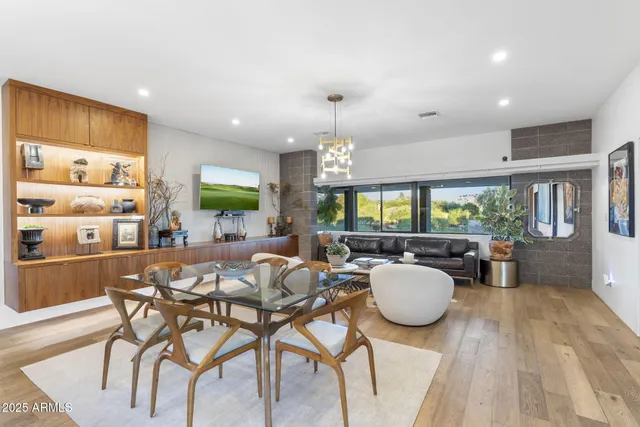 a view of a dining room with furniture window and wooden floor