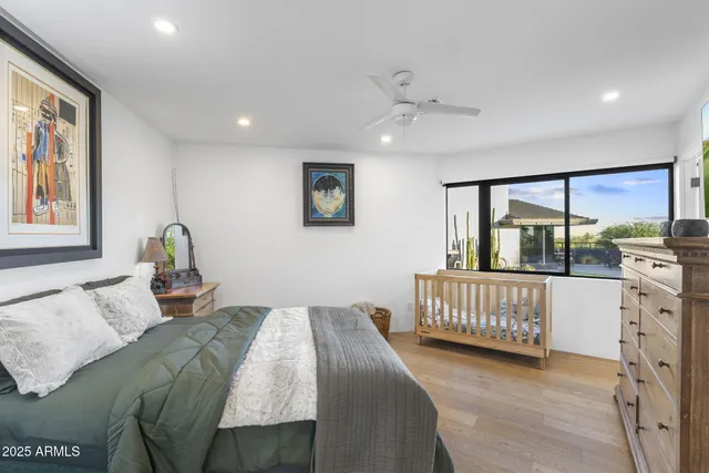 a bedroom with furniture and windows