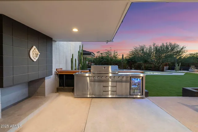 a view of a chairs and table in the patio