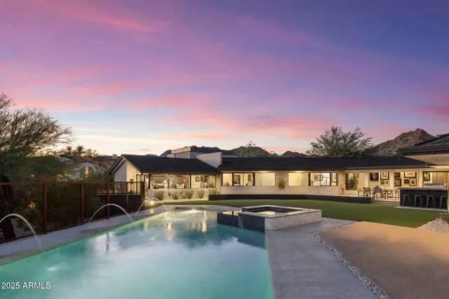 a view of swimming pool with outdoor seating