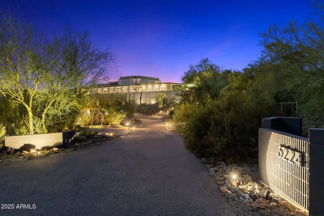 a view of a street with a building in the background