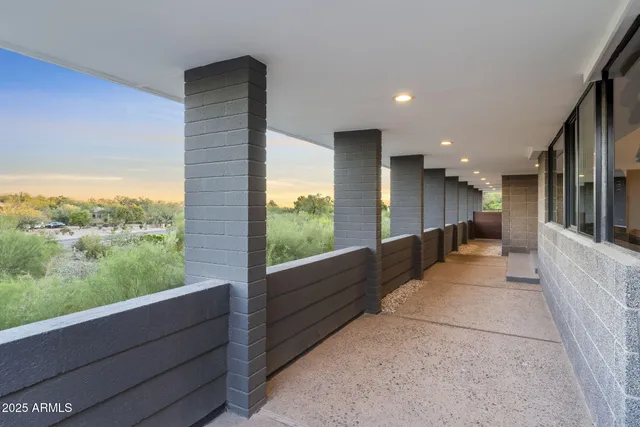 a roof deck with a lake view