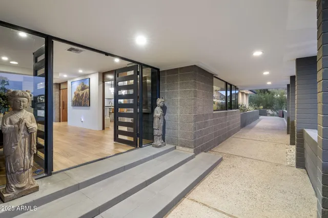 a lobby with entryway and a living room
