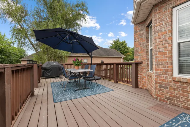 an outdoor space with furniture and umbrella