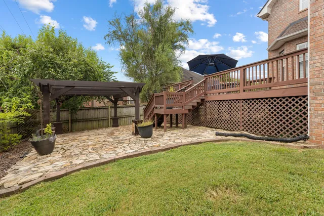 a view of backyard with sitting area