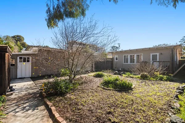a backyard of a house with a garden
