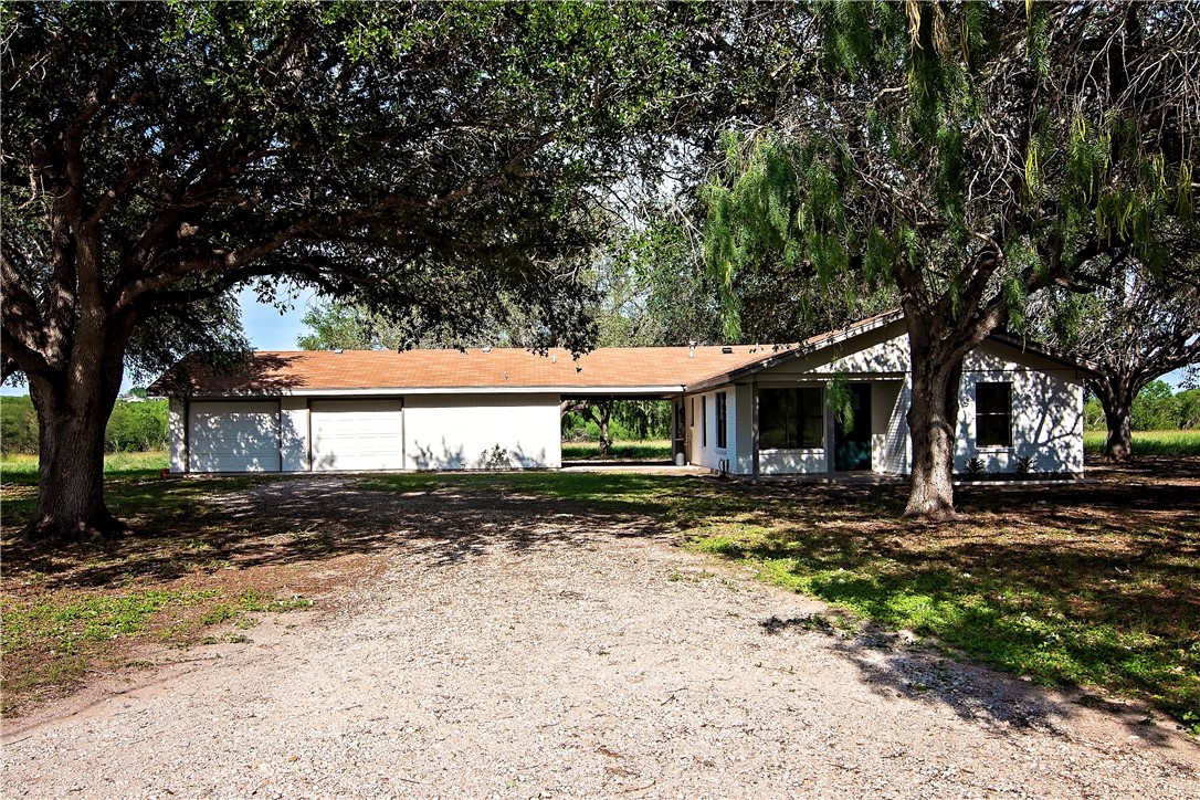 202 Ranch Road Mathis, TX 78368 - Photo 2 of 36 a front view of a house with a yard