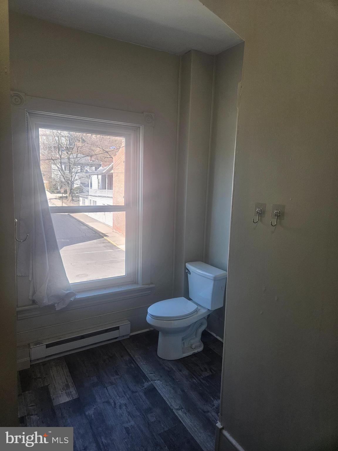 170 Valley Street Lewistown, PA 17044 - Photo 17 of 40 a bathroom with a toilet a sink and a window