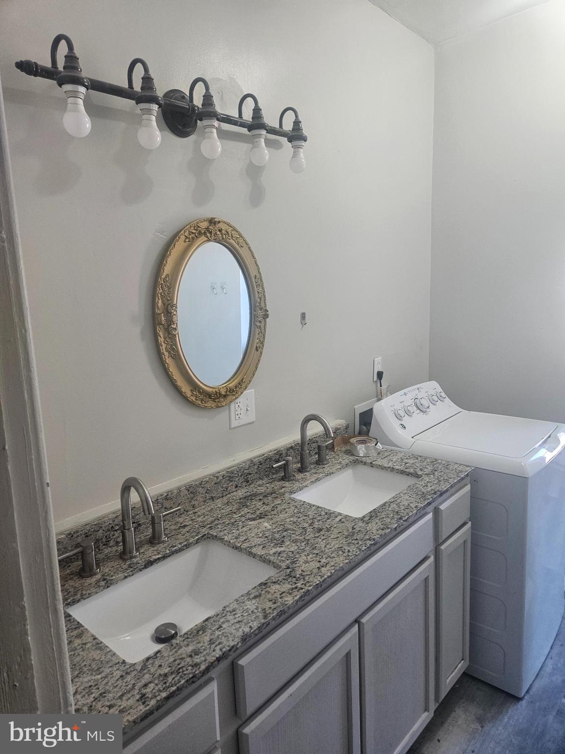 170 Valley Street Lewistown, PA 17044 - Photo 18 of 40 a bathroom with a granite countertop sink and a mirror