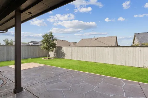 a view of backyard with green space