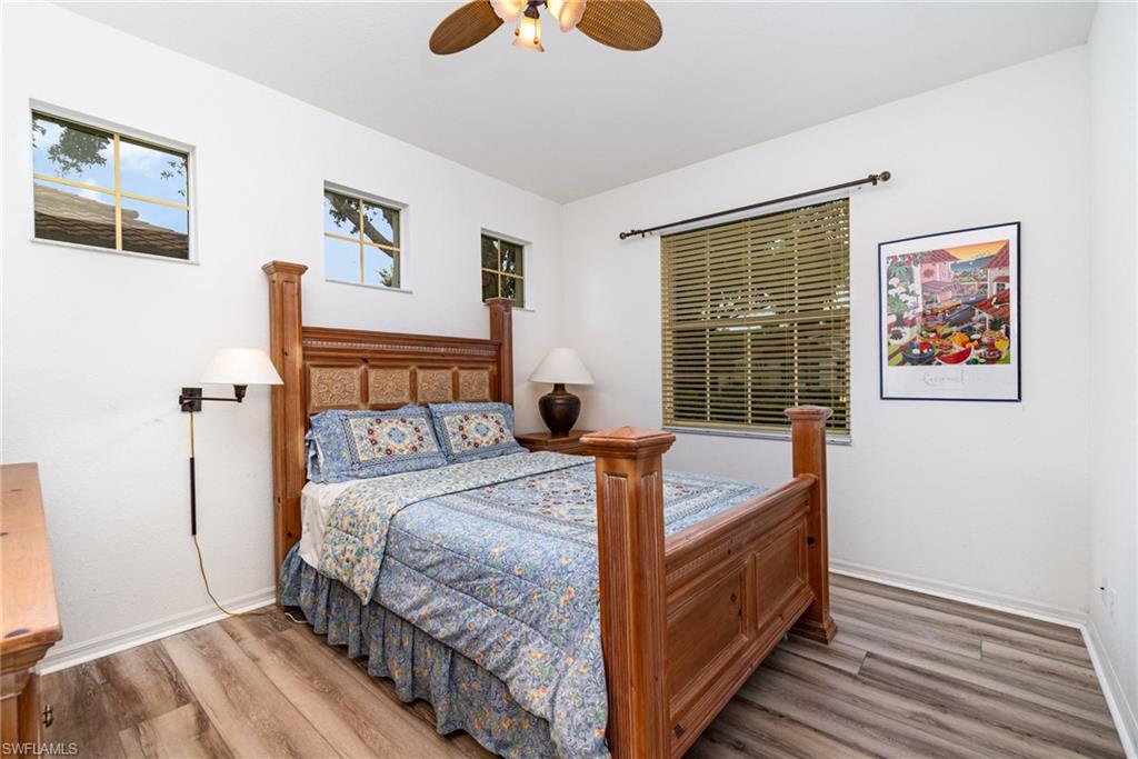 10274 Cape Roman Road, Unit 102 Estero, FL 34135 - Photo 16 of 36 a bedroom with a bed and a window