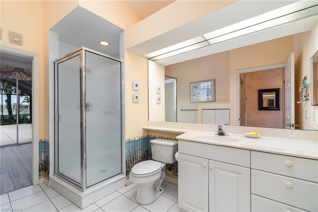 10274 Cape Roman Road, Unit 102 Estero, FL 34135 - Photo 20 of 36 a bathroom with a sink toilet and shower