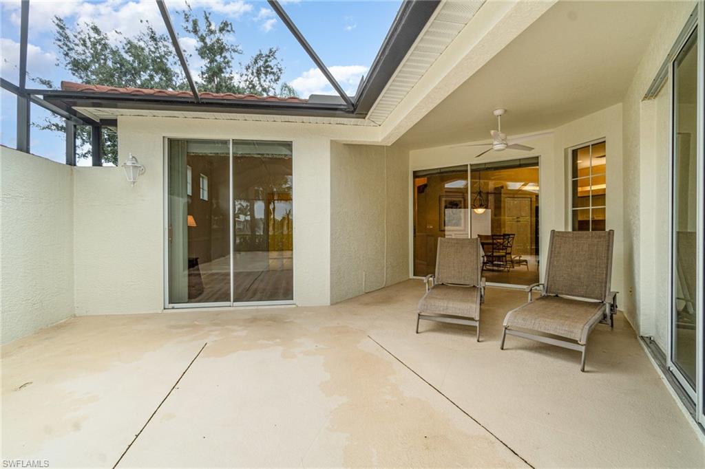 10274 Cape Roman Road, Unit 102 Estero, FL 34135 - Photo 22 of 36 a view of chair with door in the room
