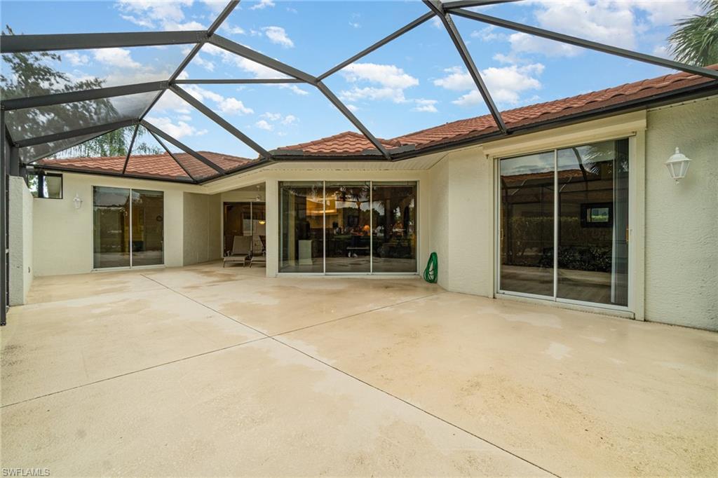 10274 Cape Roman Road, Unit 102 Estero, FL 34135 - Photo 23 of 36 a view of a house with a garage