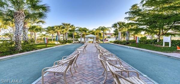 10274 Cape Roman Road, Unit 102 Estero, FL 34135 - Photo 29 of 36 a view of an outdoor space with seating