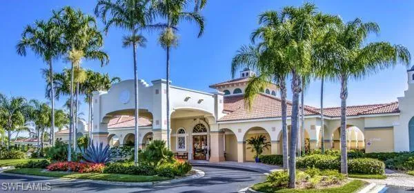 a view of houses with swimming pool and a yard