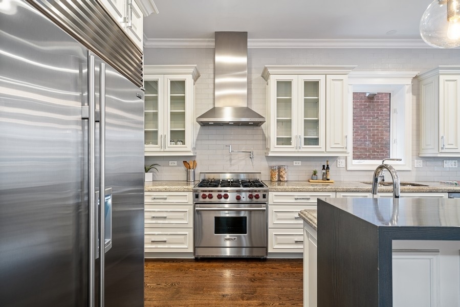 1904 West Wolfram Street Chicago, IL 60657 - Photo 15 of 56 a kitchen with a stove oven and sink