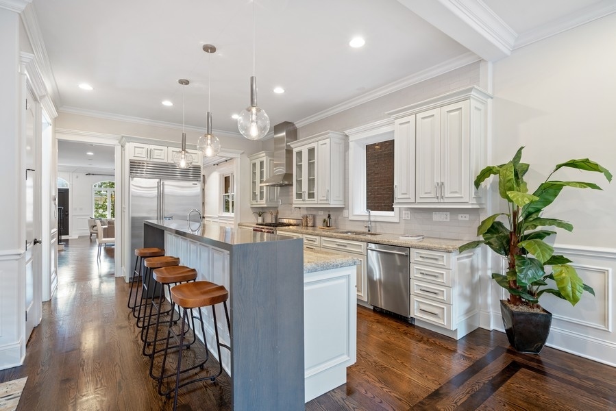 1904 West Wolfram Street Chicago, IL 60657 - Photo 16 of 56 a kitchen with counter top space a sink appliances and living room view