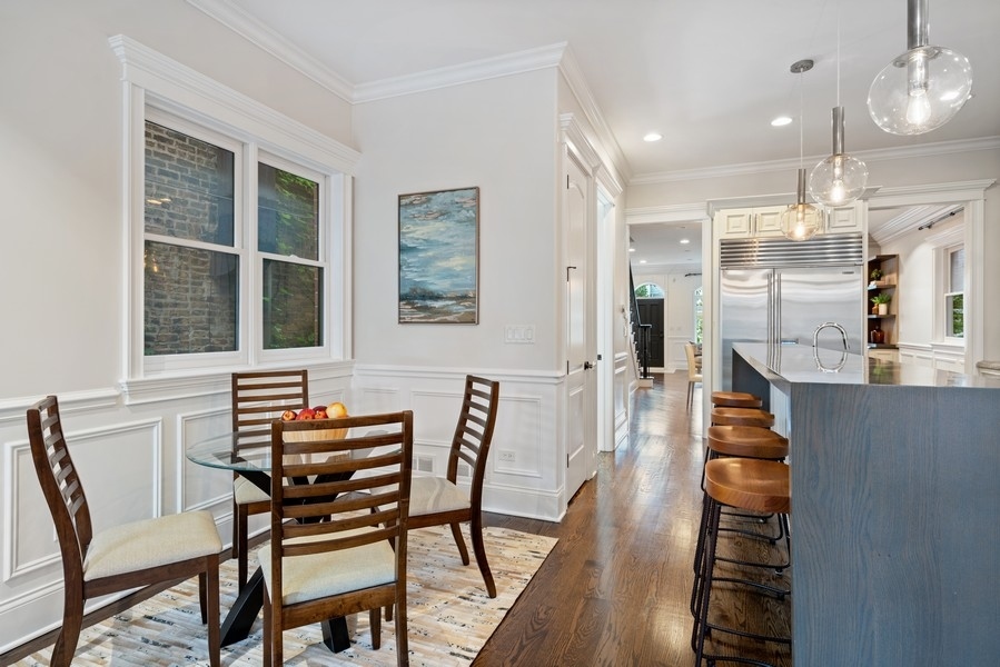 1904 West Wolfram Street Chicago, IL 60657 - Photo 20 of 56 a dining room with furniture and wooden floor