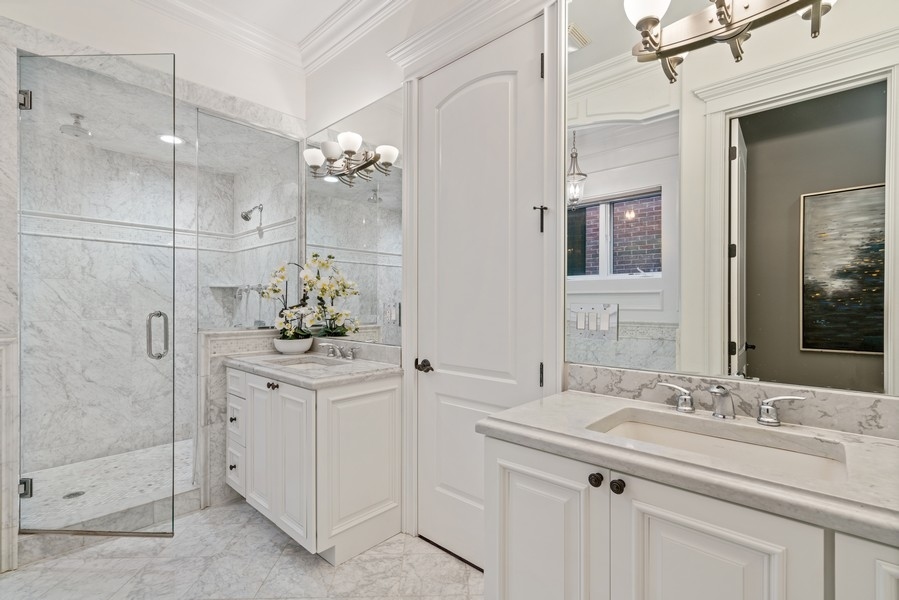 1904 West Wolfram Street Chicago, IL 60657 - Photo 31 of 56 a bathroom with a sink vanity and a mirror