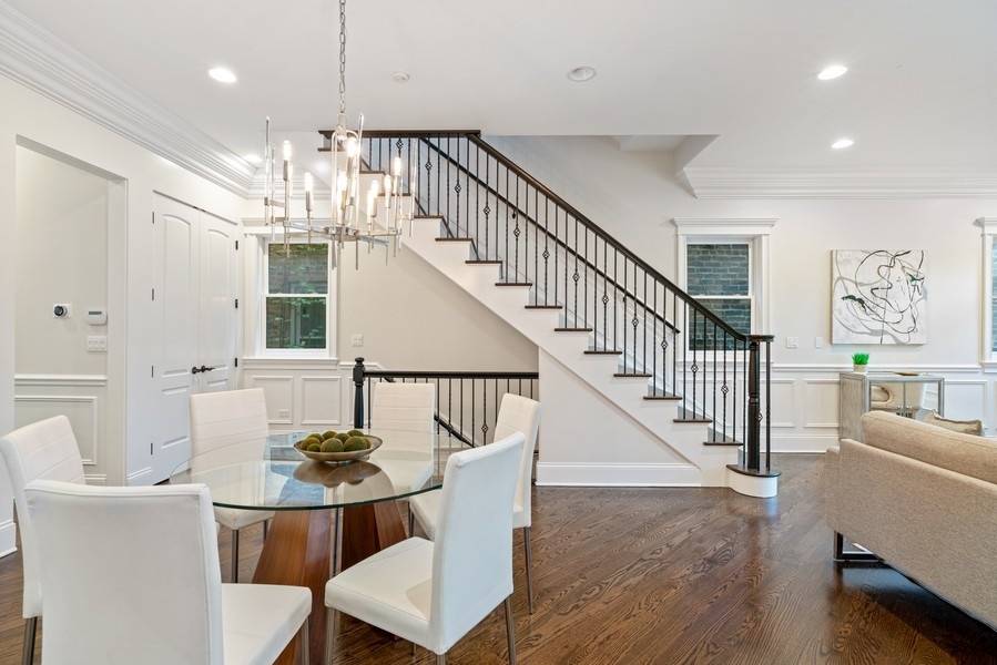 1904 West Wolfram Street Chicago, IL 60657 - Photo 5 of 56 a view of a dining room with furniture a chandelier and wooden floor
