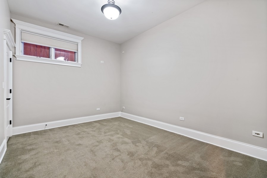 1904 West Wolfram Street Chicago, IL 60657 - Photo 47 of 56 an empty room with windows
