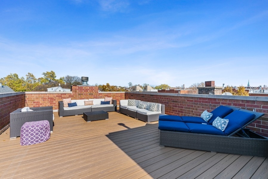 1904 West Wolfram Street Chicago, IL 60657 - Photo 50 of 56 a view of a terrace with wooden benches