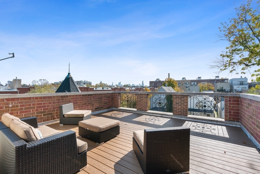 1904 West Wolfram Street Chicago, IL 60657 - Photo 54 of 56 a view of a rooftop deck with couch and chairs