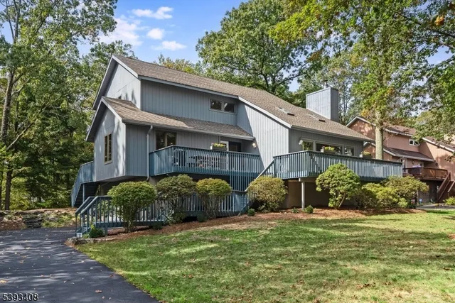 a view of a house with a back yard
