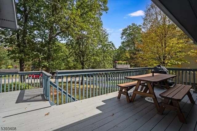 a view of a deck with wooden floor and outdoor seating