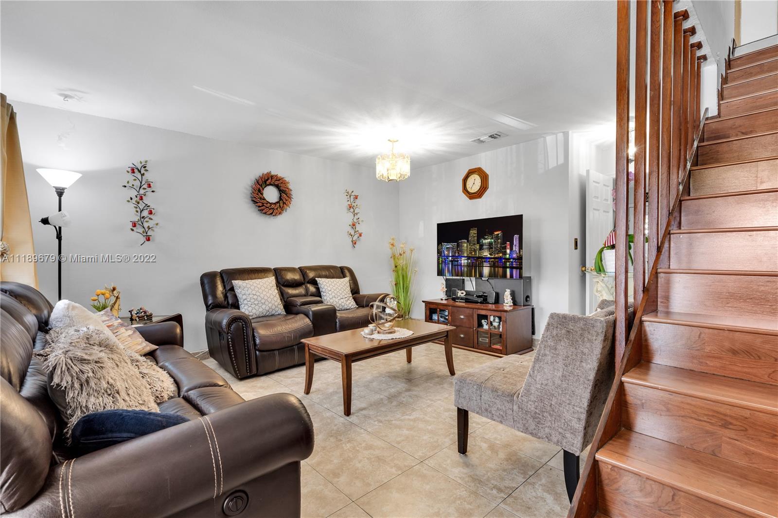 627 West 68th Street, Unit 627 Hialeah, FL 33014 - Photo 14 of 31 a living room with furniture and a flat screen tv