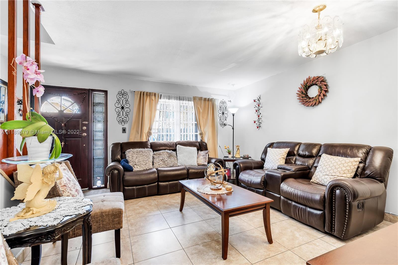 627 West 68th Street, Unit 627 Hialeah, FL 33014 - Photo 15 of 31 a living room with furniture