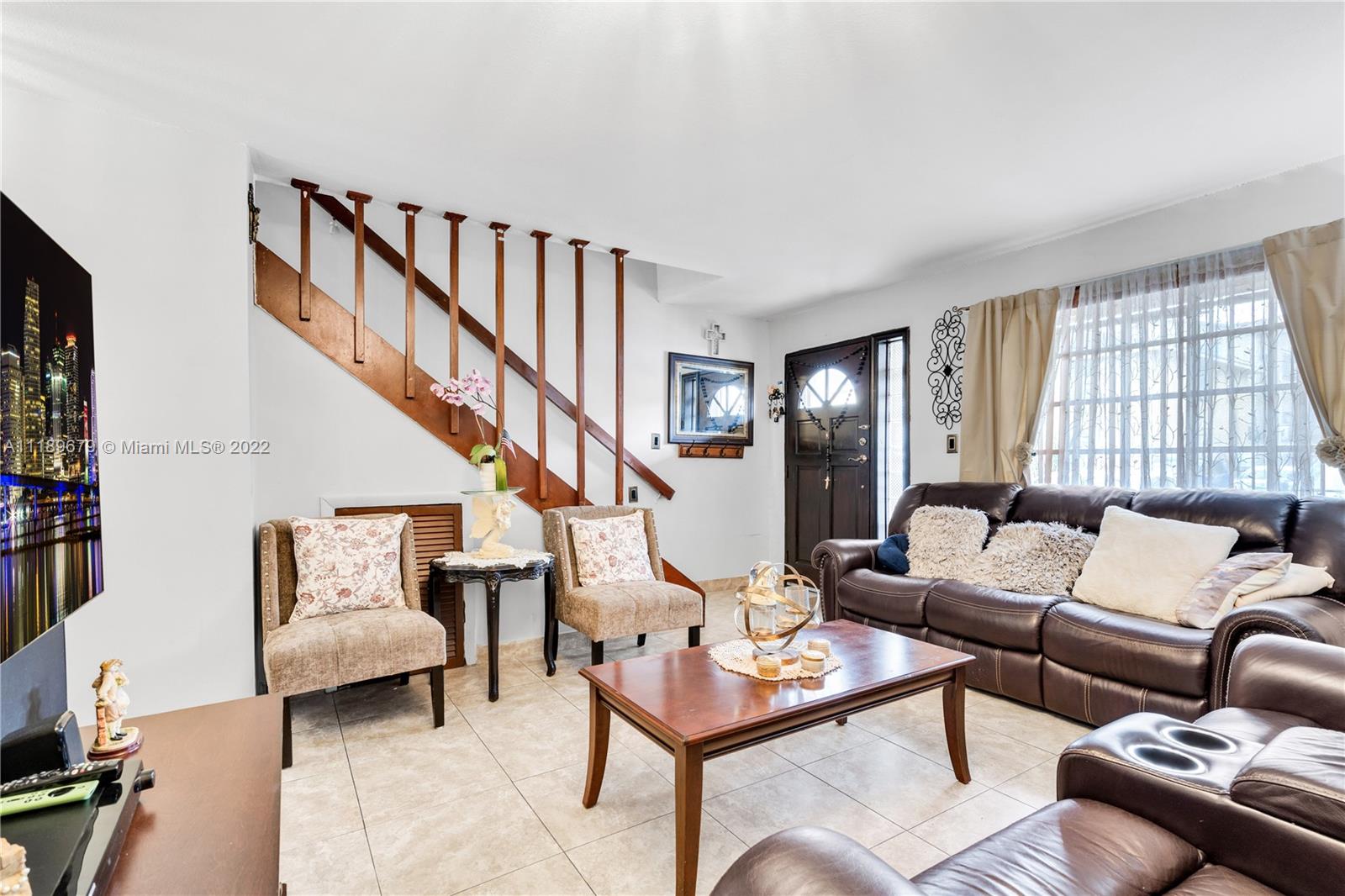 627 West 68th Street, Unit 627 Hialeah, FL 33014 - Photo 16 of 31 a living room with furniture or couch and a window