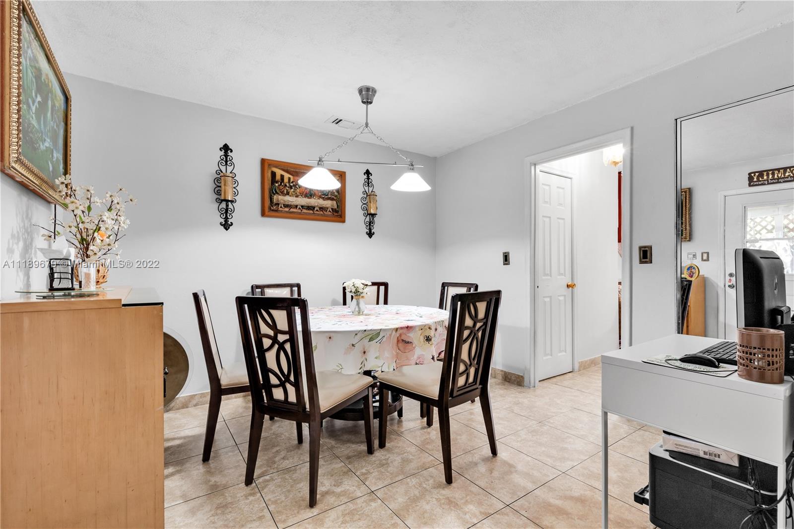 627 West 68th Street, Unit 627 Hialeah, FL 33014 - Photo 18 of 31 a view of a dining room with furniture