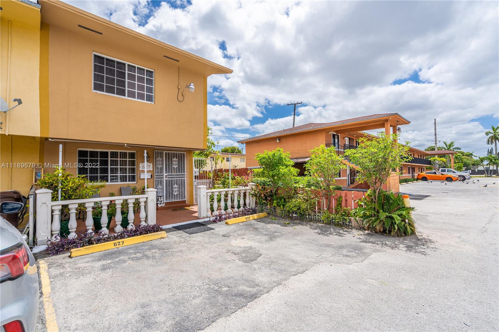 627 West 68th Street, Unit 627 Hialeah, FL 33014 - Photo 2 of 31 a view of a blue sign on the side of a street