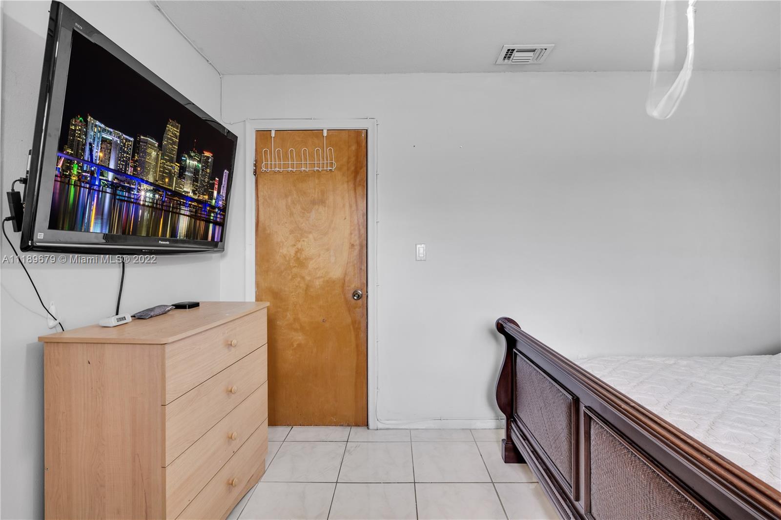 627 West 68th Street, Unit 627 Hialeah, FL 33014 - Photo 24 of 31 a view of cabinets with wooden floor and cabinets