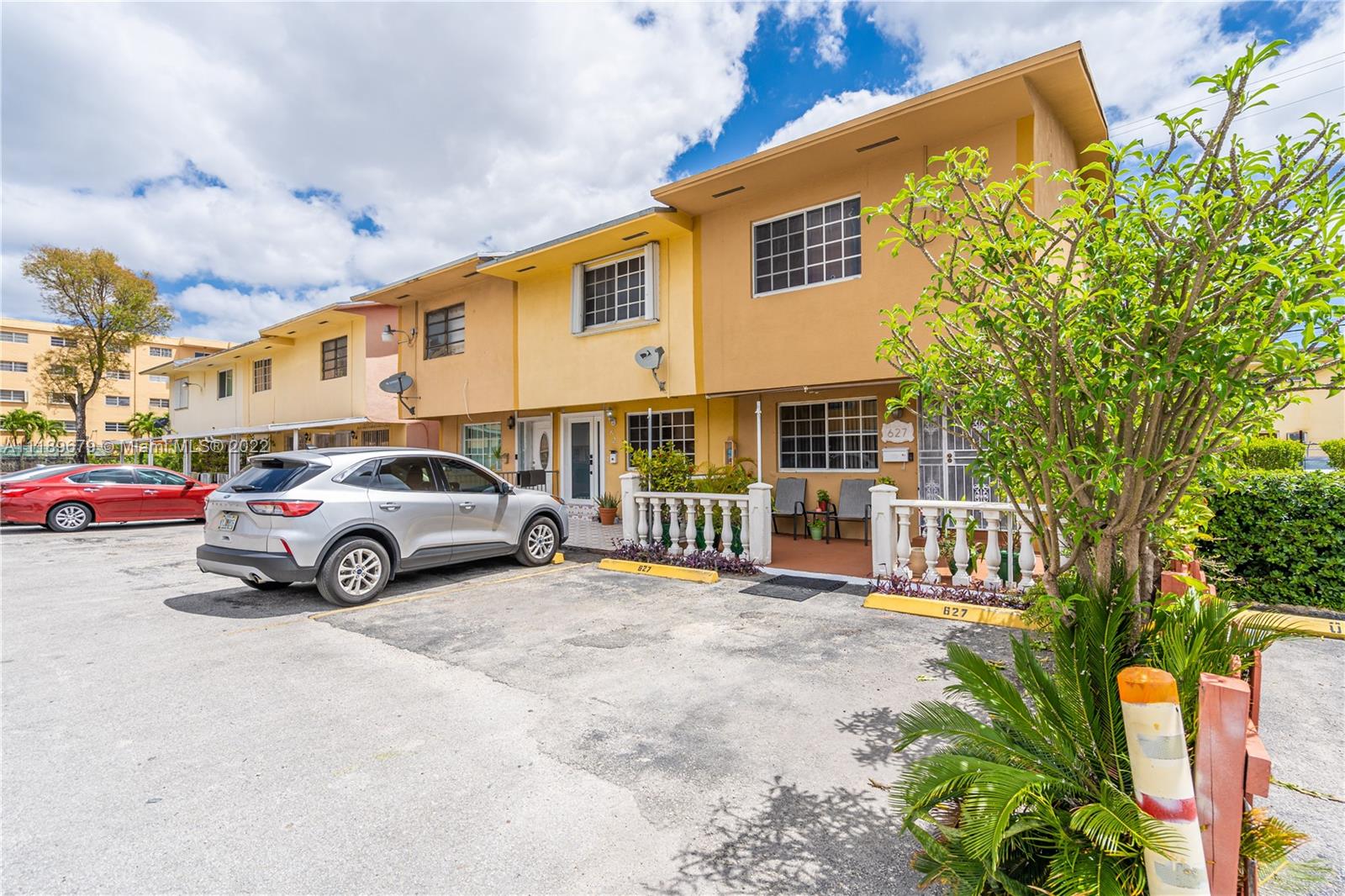 627 West 68th Street, Unit 627 Hialeah, FL 33014 - Photo 3 of 31 a view of car parked in front of a house