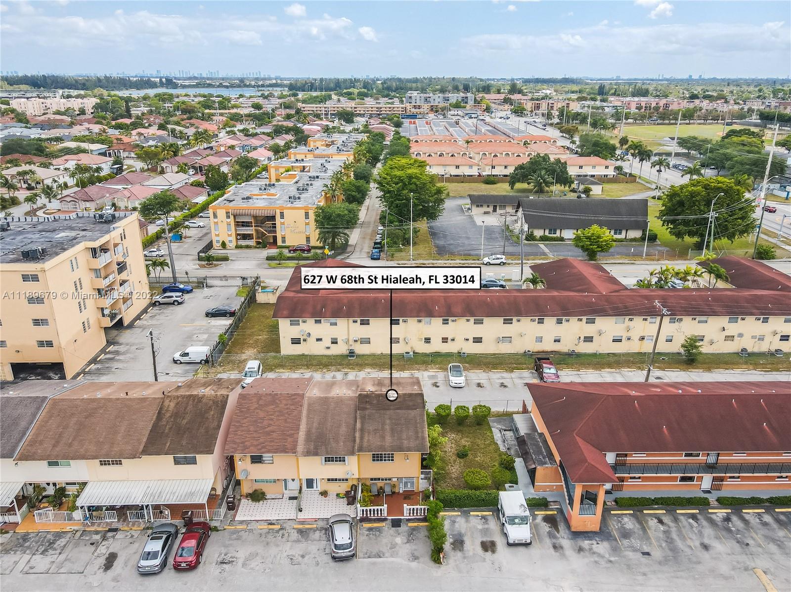 627 West 68th Street, Unit 627 Hialeah, FL 33014 - Photo 7 of 31 an aerial view of a houses with a swimming pool
