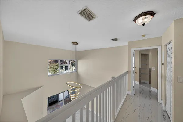 a view of a hallway with workspace